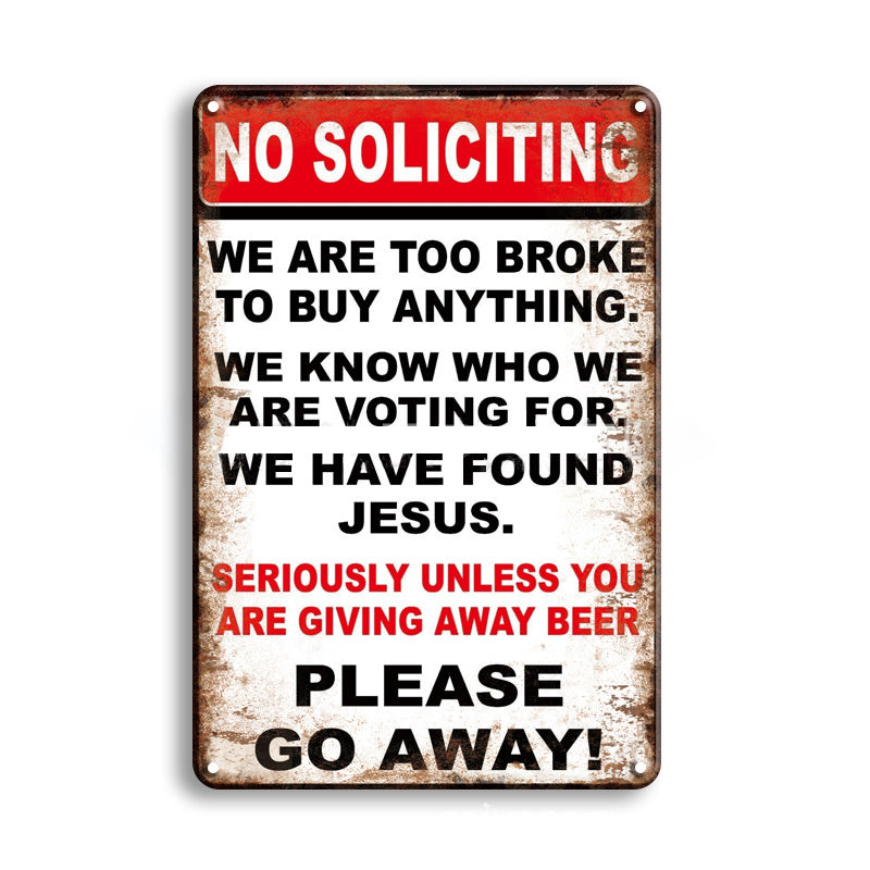 Metal sign with humorous text about no soliciting on a white background