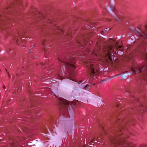 Close-up of a clear plastic connector on pink tinsel