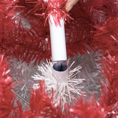 White Christmas tree brush with red tinsel on a red Christmas tree.